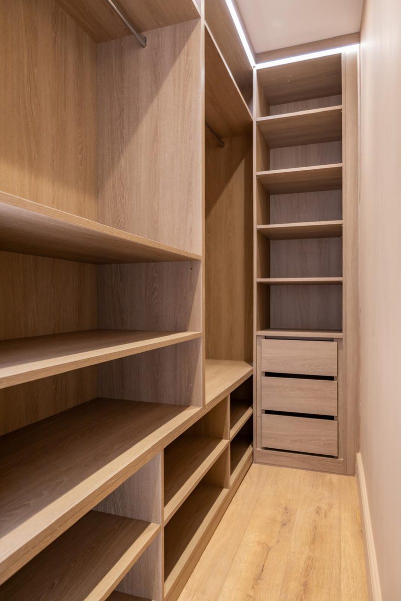 Fitted oak wardrobe with shelving and drawers