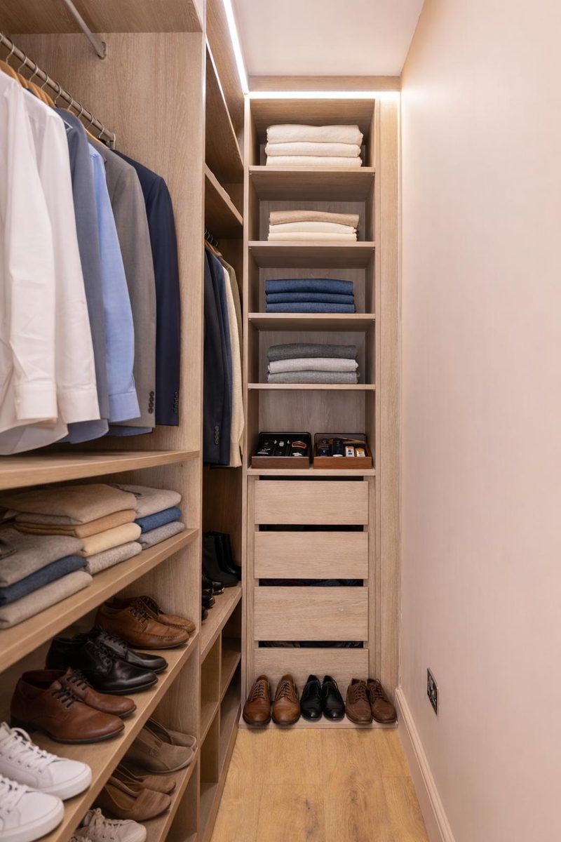 Walk-in wardrobe with hanging rails, shelves and shoe storage