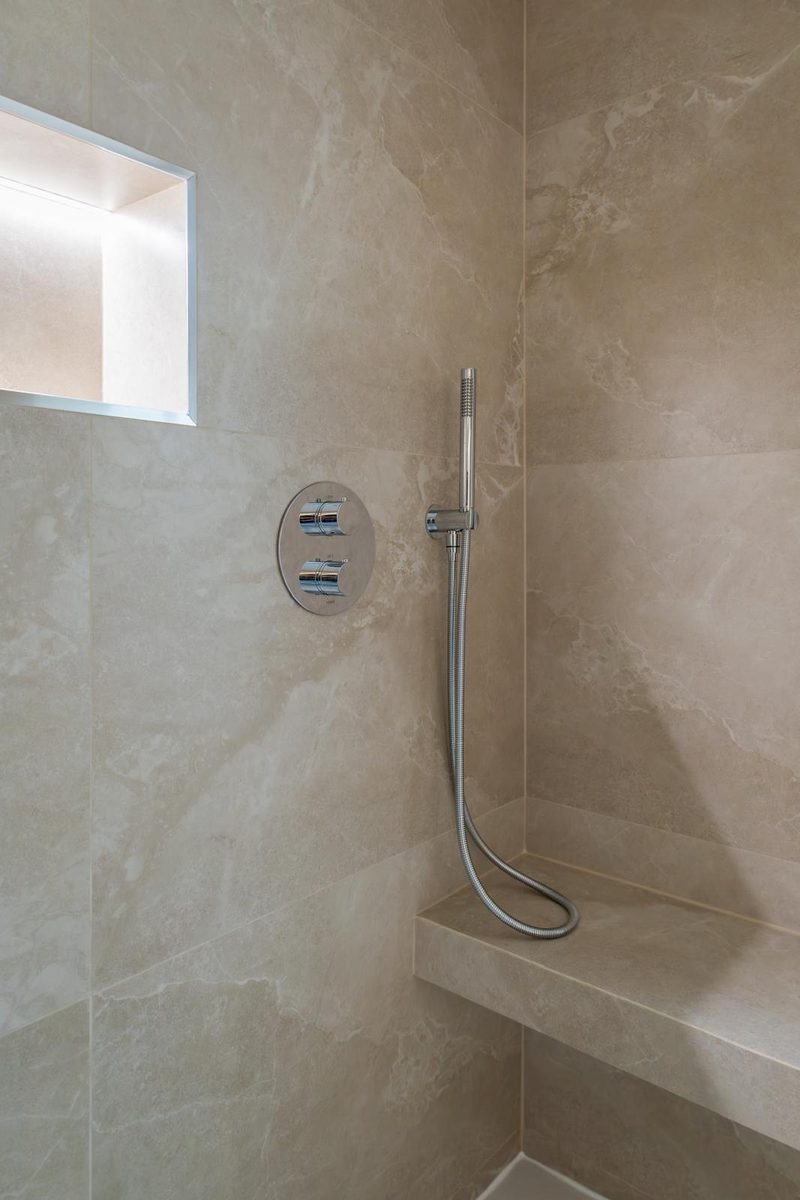Brushed-steel shower controls with recessed niche