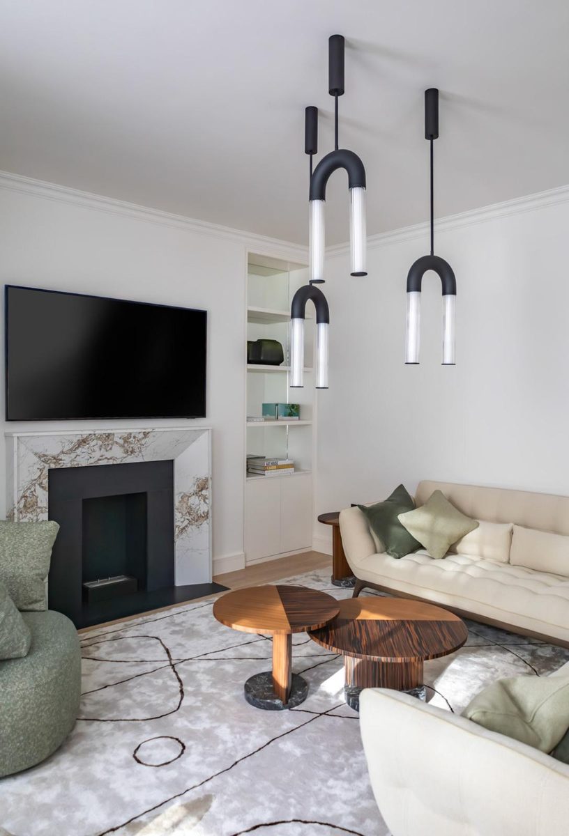 Living room with pendant lights, fireplace and media wall