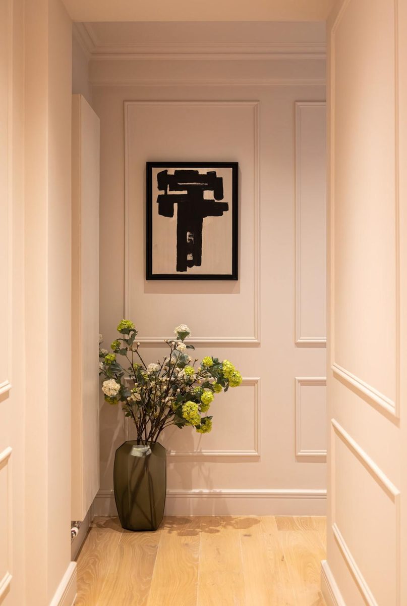 Panelled hallway with framed artwork