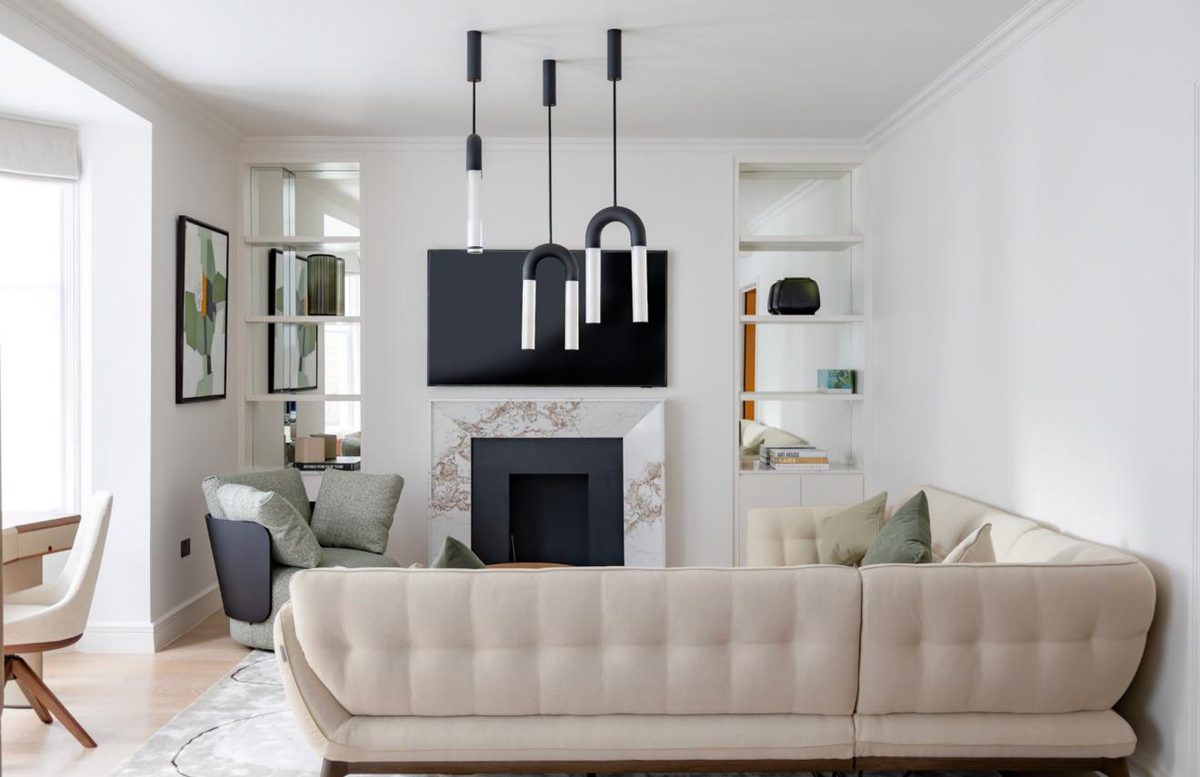 Living room with marble fireplace and sectional sofa