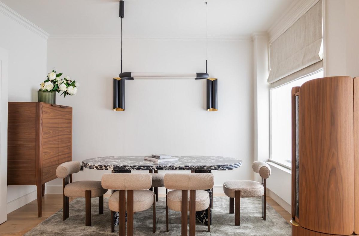 Dining area with marble table and walnut sideboard